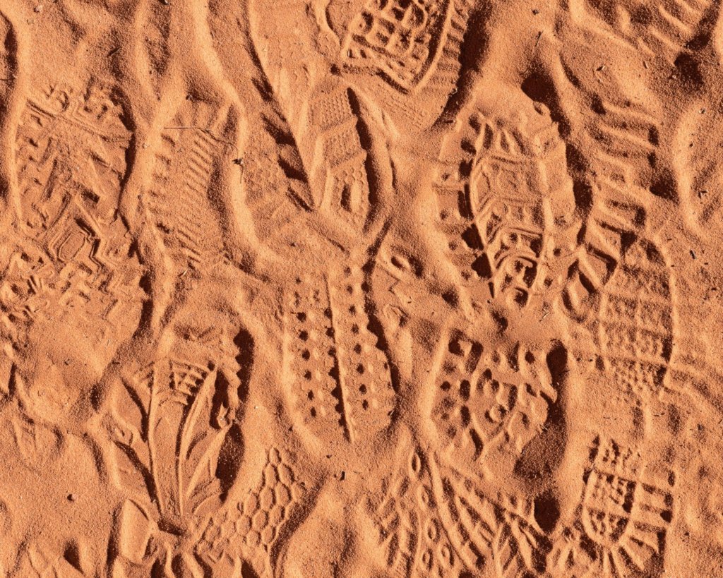 Sandy trails and footsteps in Arches.