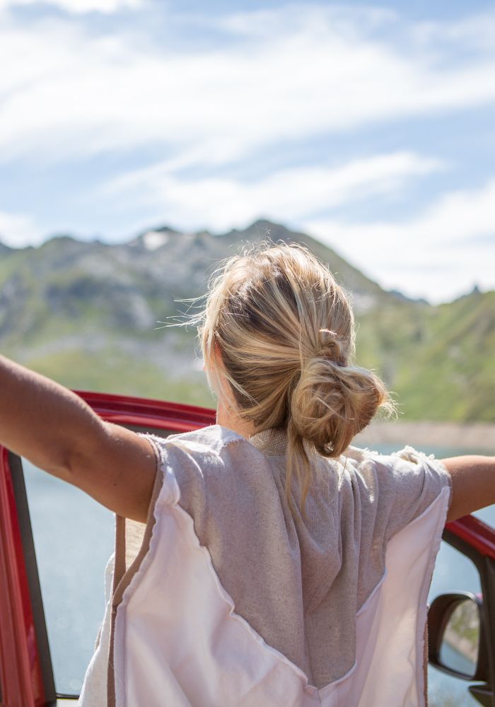 Things to Do on a Road Trip with Friends - girl taking a break from driving.